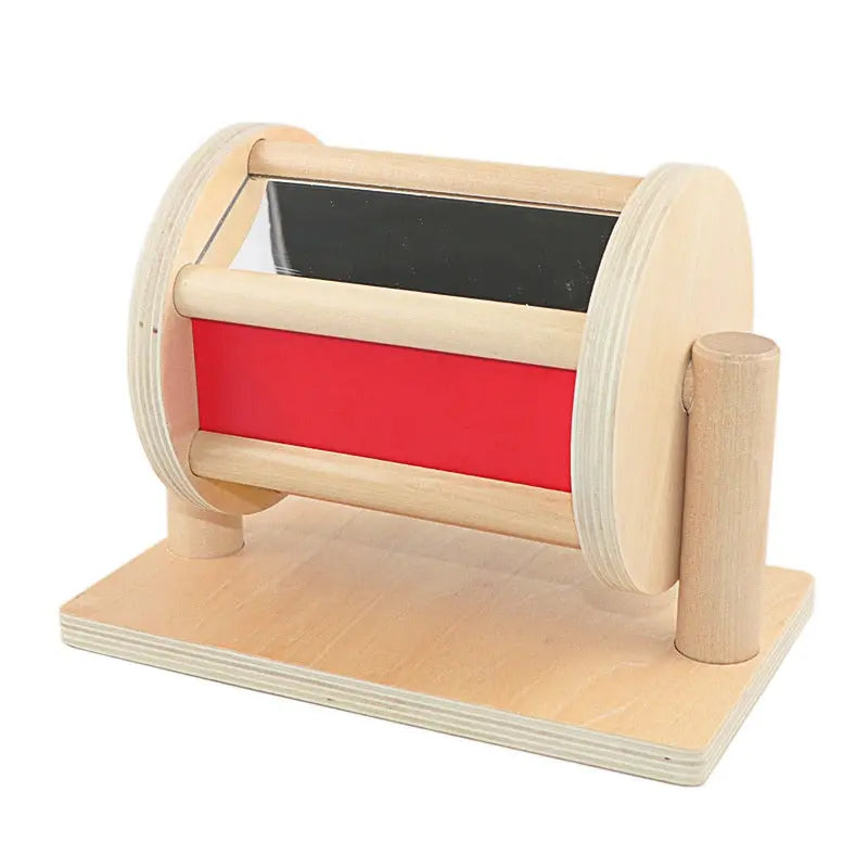Rotating drum with mirror and ball inside