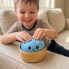 Child squishing the blue Mystery Dumpling Squishy