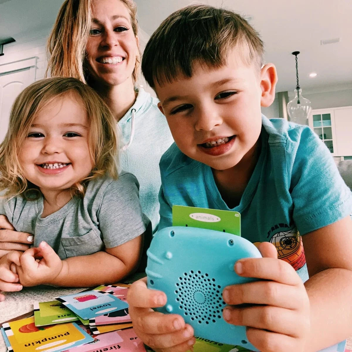 Kid playing with learning flashcard toy MyFirstWords